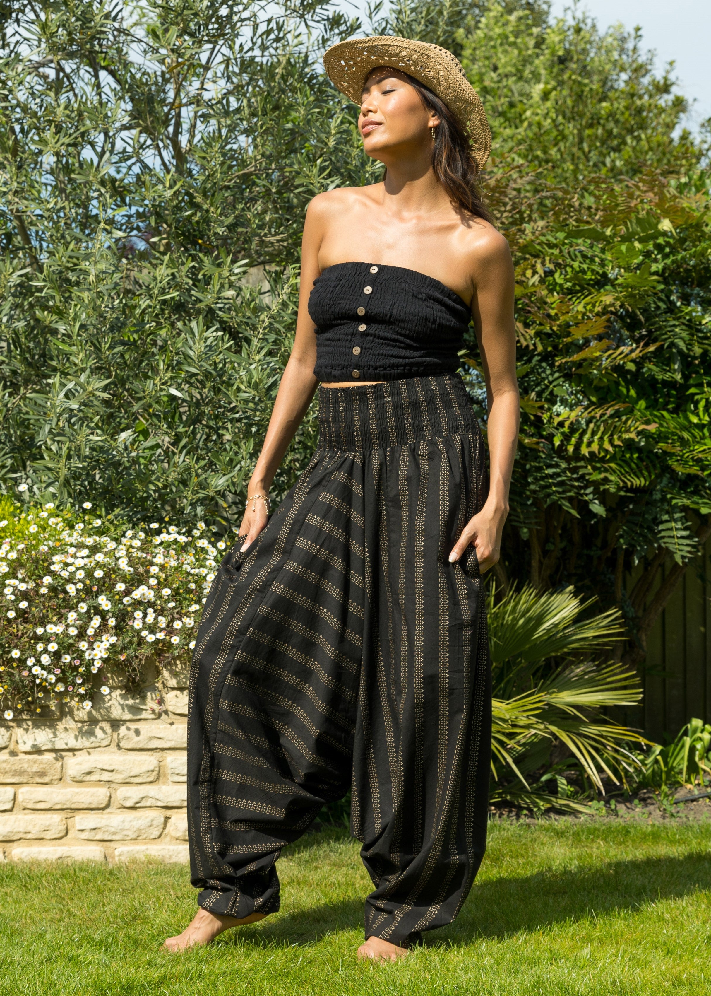 black harem pants styled with tube top for relaxed summer bbq outfit