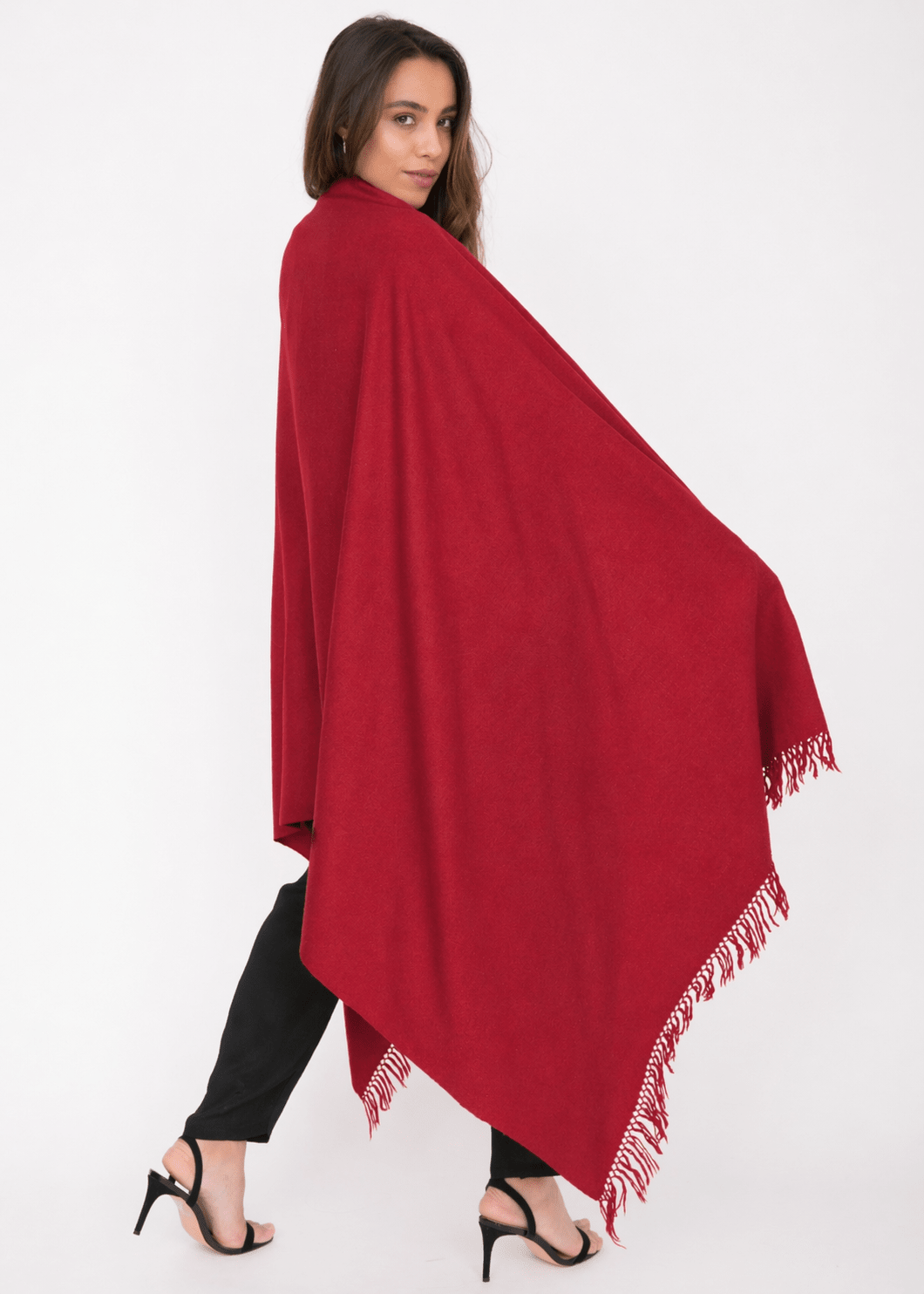 Woman wearing a red merino wool shawl scarf