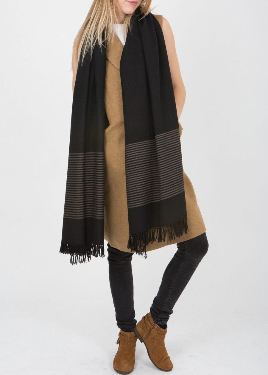 oversized black blanket scarf with border stripes, handwoven in 100% merino wool with hand-knotted fringing, 100 x 200 cm