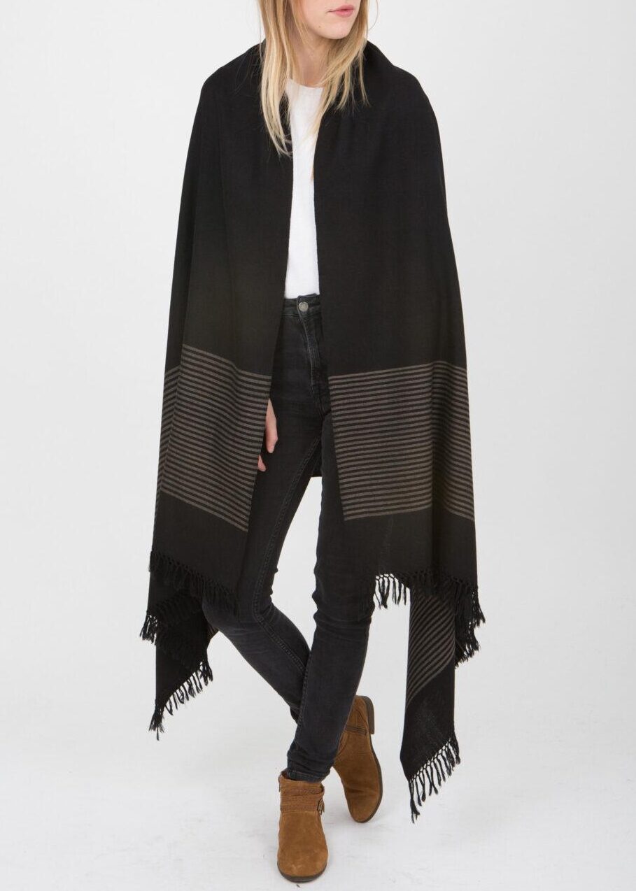 handwoven black merino wool blanket scarf by likemary, featuring stripes at the border and hand-knotted fringe