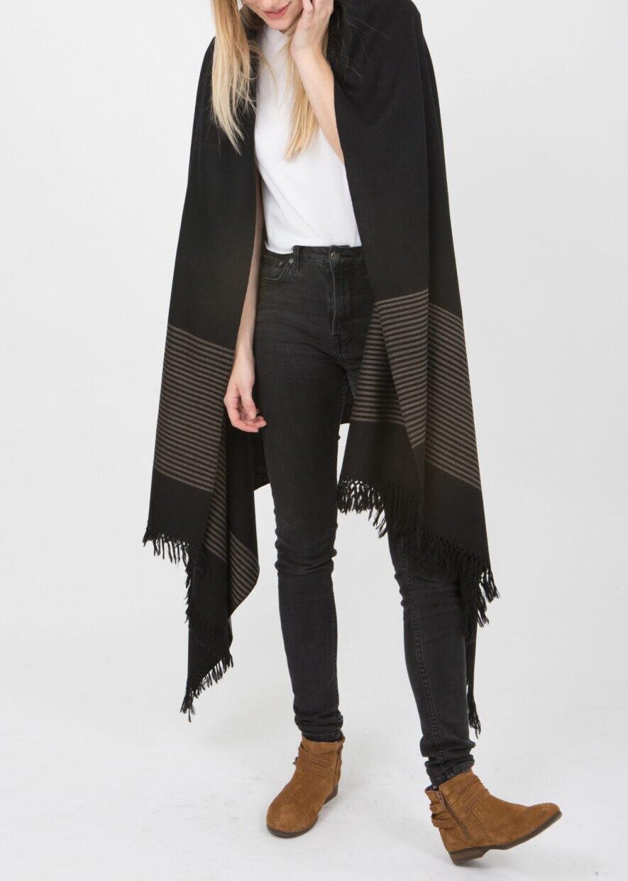 luxurious oversized black merino wool scarf with striped border and hand-knotted fringes, ethically handmade